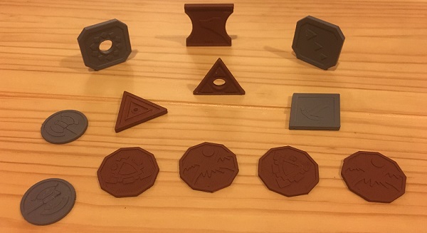 3D printed tabletop role playing game coins with gray and brown primer