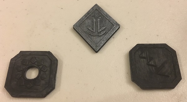 3D printed tabletop gaming coins painted black and silver