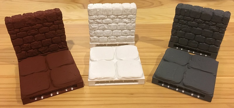 White, brown, and gray 3D printed dungeon tiles and walls painted with primer