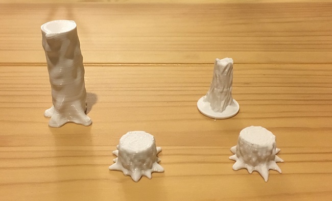 3D printed tree trunks and stumps for tabletop gaming.