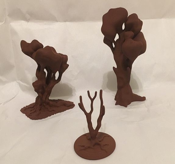 3D printed trees with brown primer.
