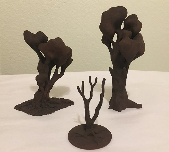 3D printed trees with dark brown paint.