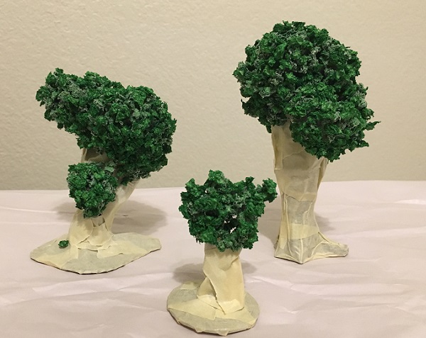 3D printed trees with the trunks covered in masking tape and the clump foliage glued on..
