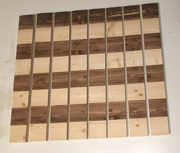 Strips of wood cut out for pine chess board